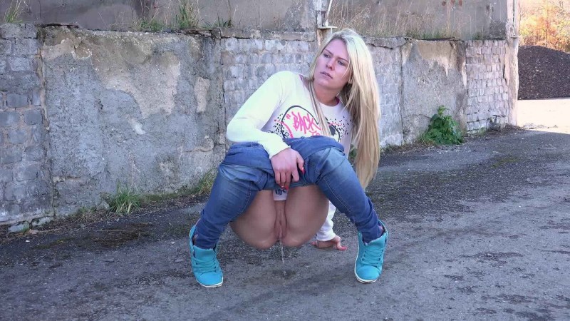 The girl pisses a powerful stream