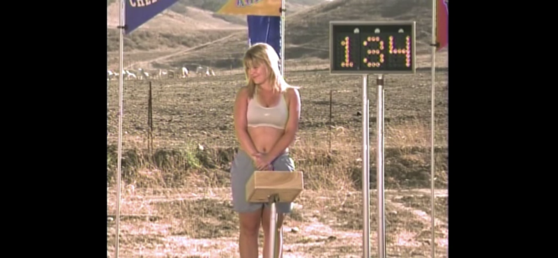 The girl undresses in the car in front of the boy