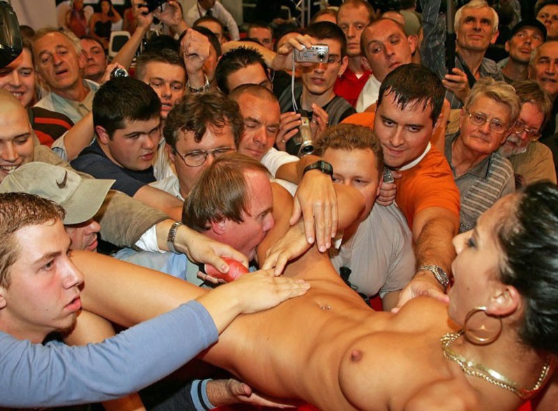 A crowd of men undress