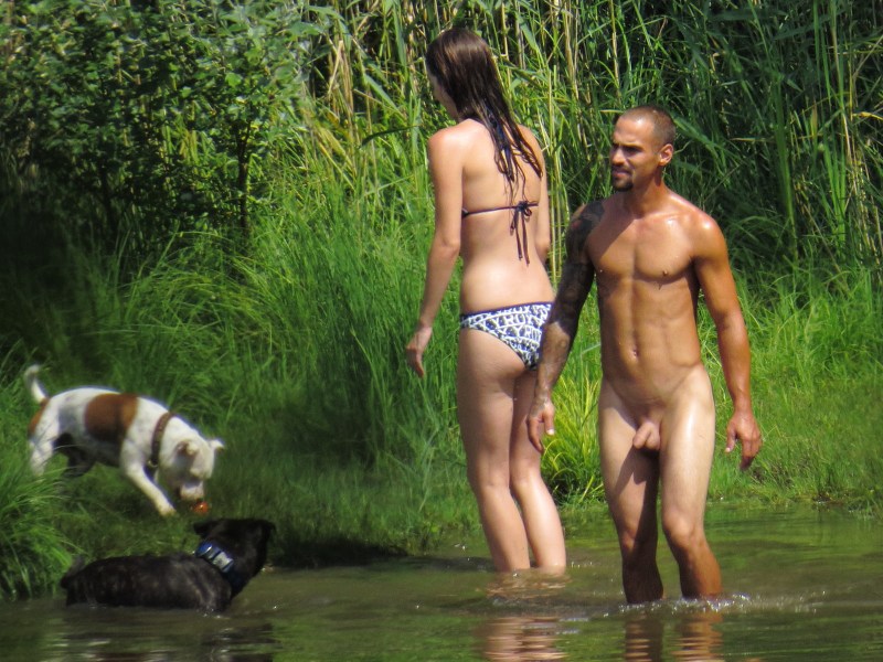 Naked in nature among dressed