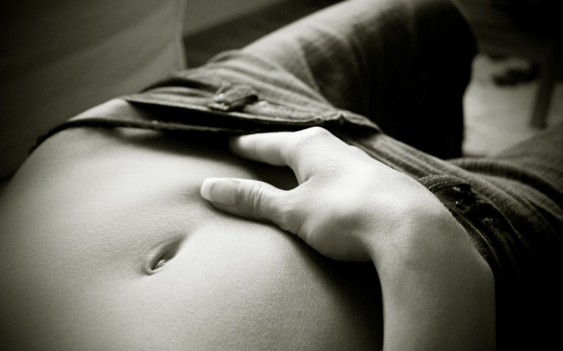 Beautiful female stomach lying