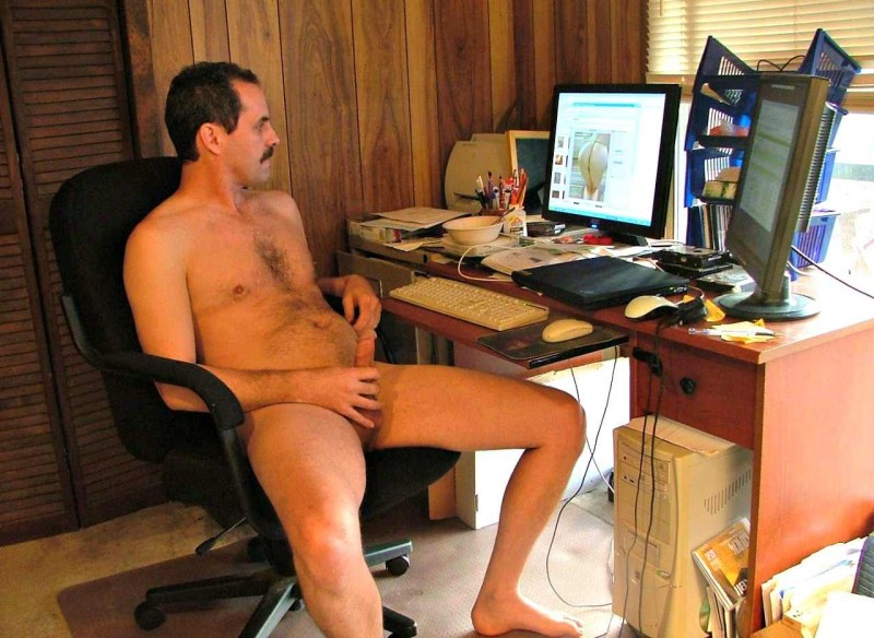 Naked man in the office photo shoot
