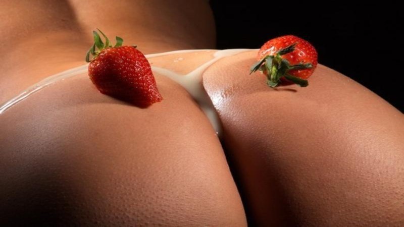 Erotic photo shoot with strawberries