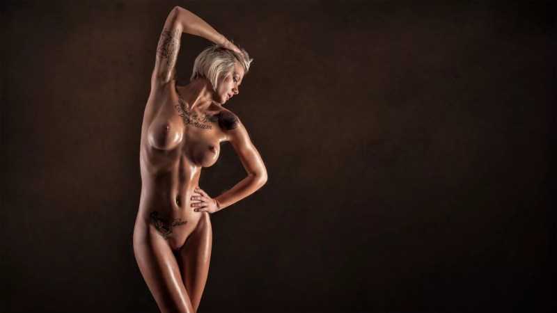 Naked woman on a black background