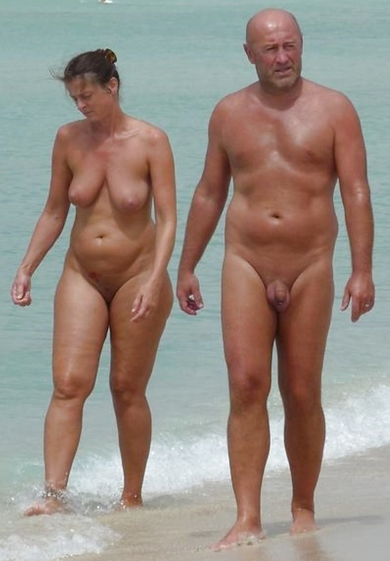 Naked man and woman at sea