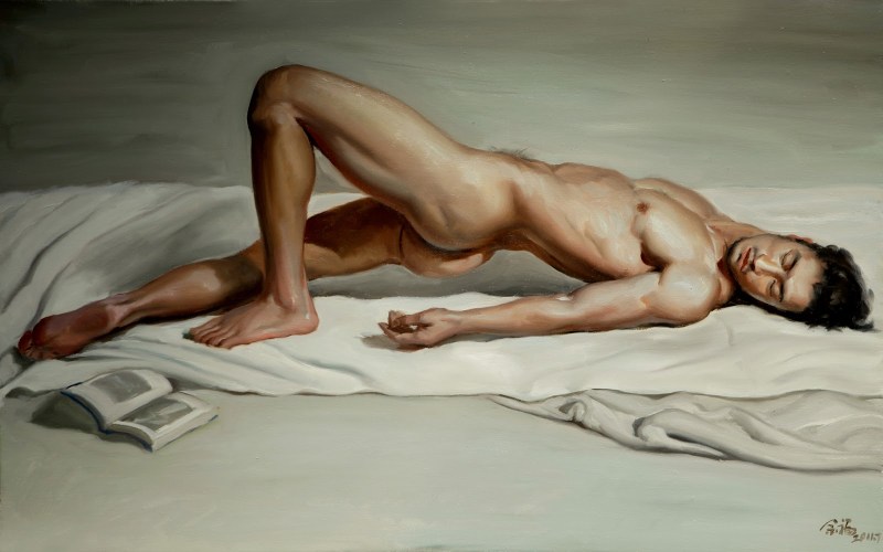 A naked man poses a model