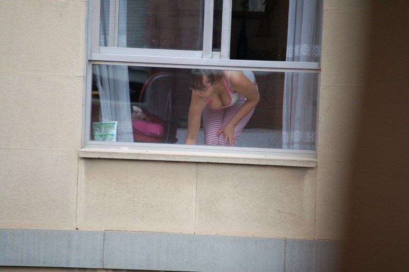 Naked woman through the window