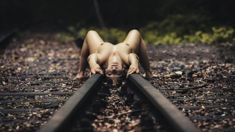 Naked women on rails