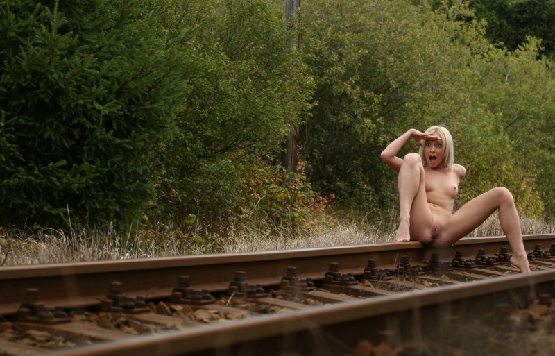 Undresses on the railway