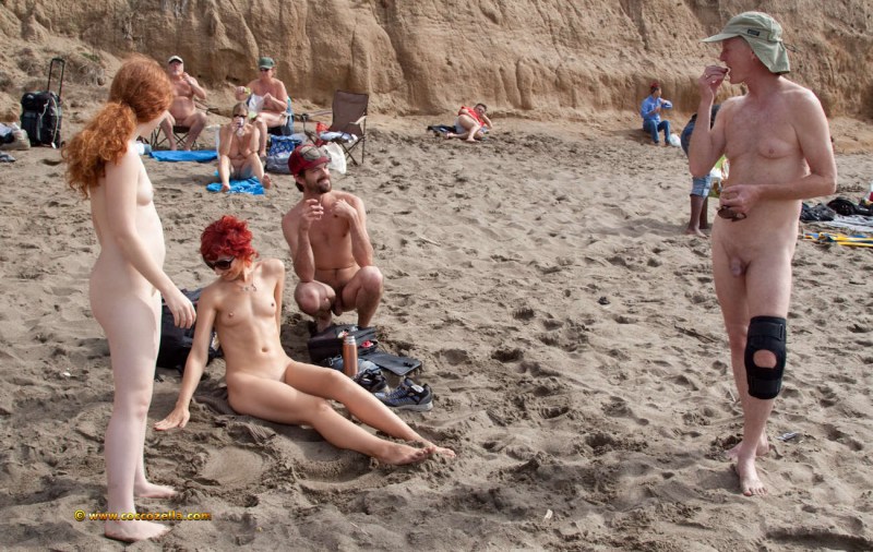 Naked girls with guys on the beach