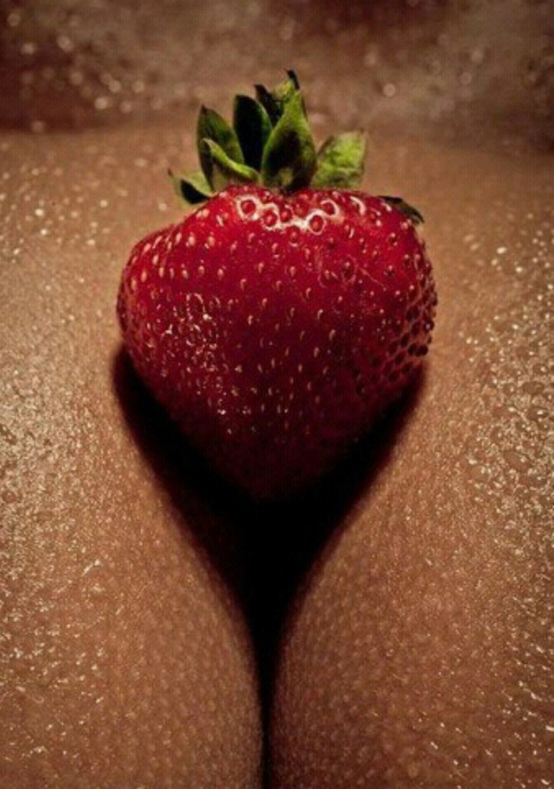 Strawberry on a bare body