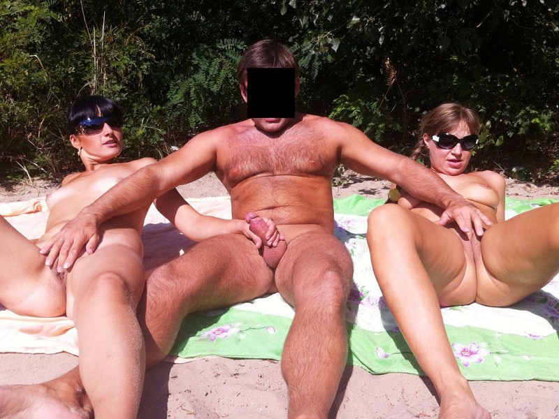 Katya Clover with guys on the beach