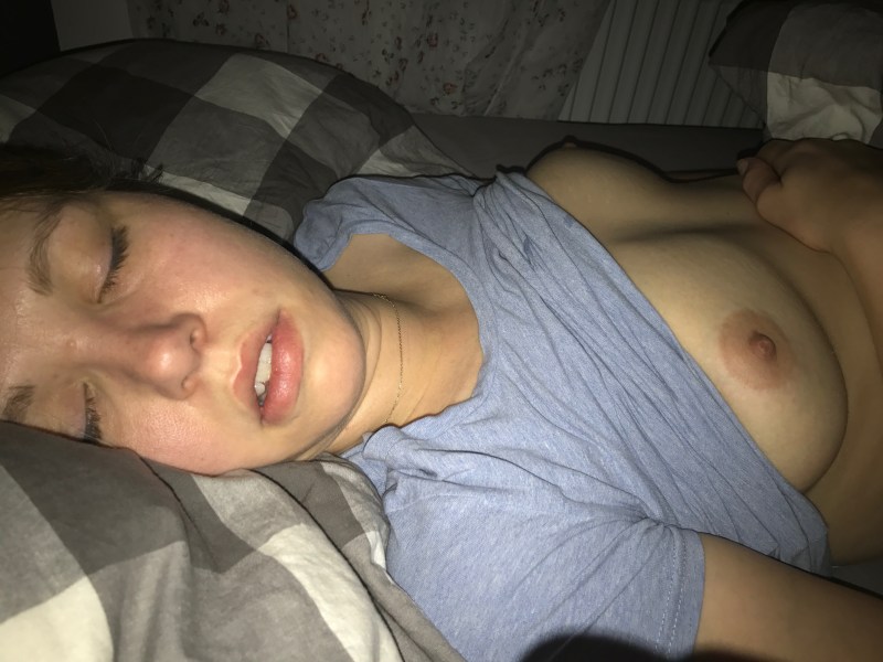 The girl is sleeping and it is visible boobs