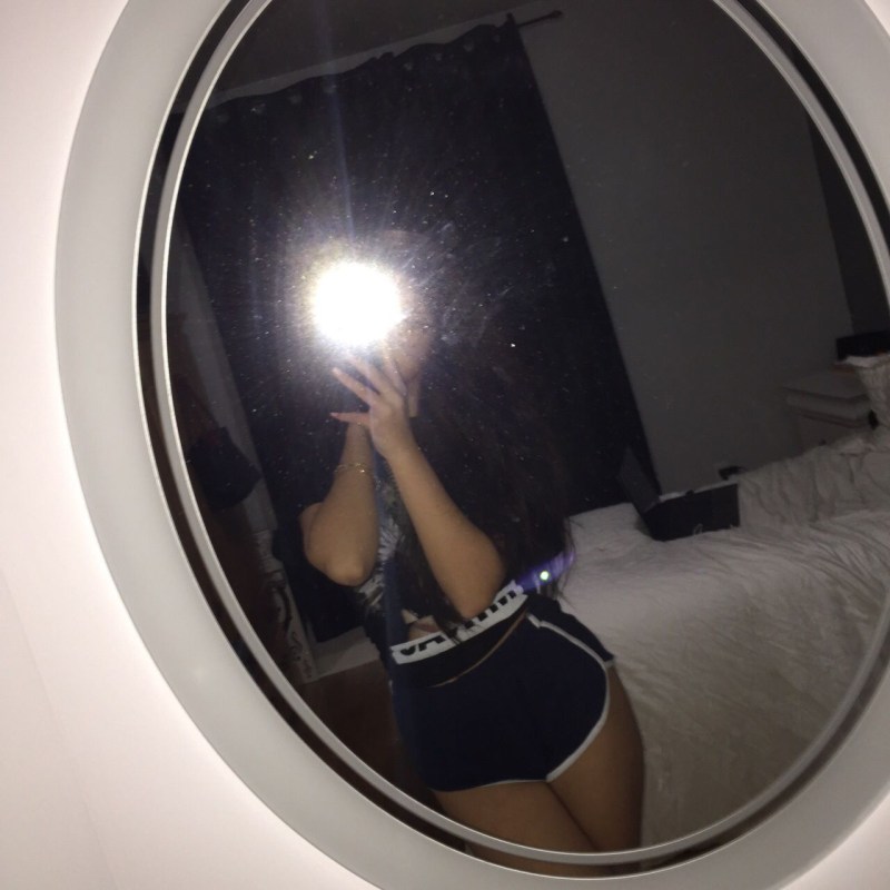 Girl in bed in a T -shirt