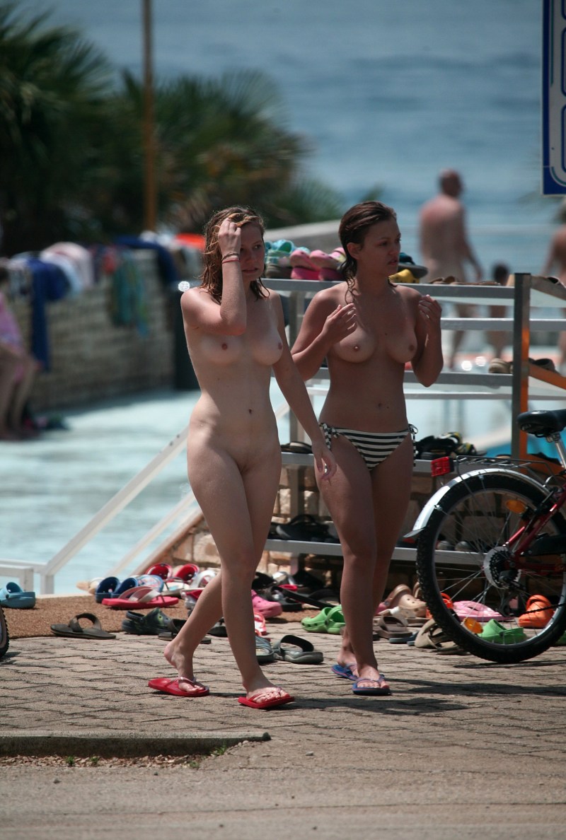 Milf on the beach spreading his legs