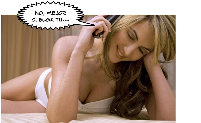 A woman with a phone in bed