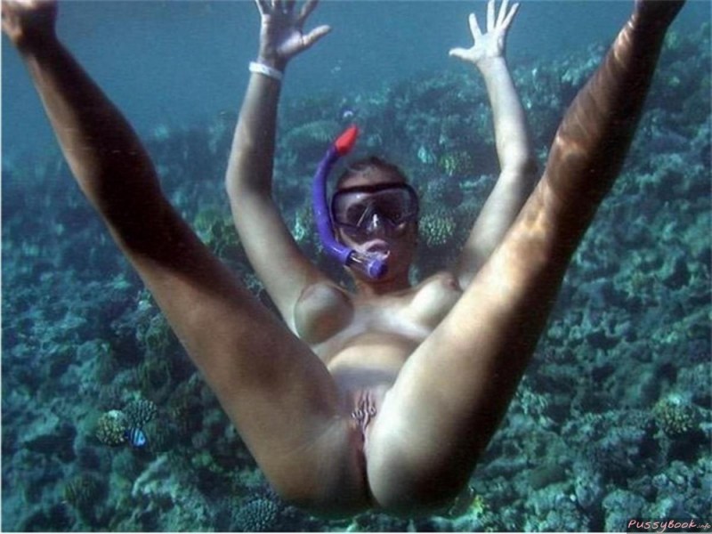 Naked women with flippers underwater