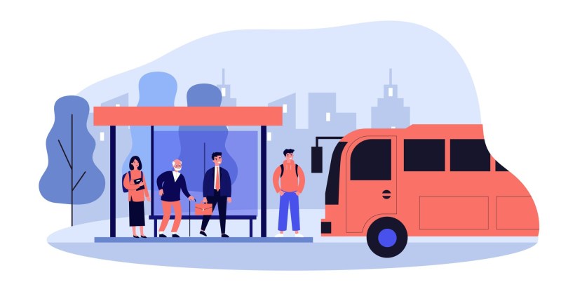 Woman in a business suit at a bus stop