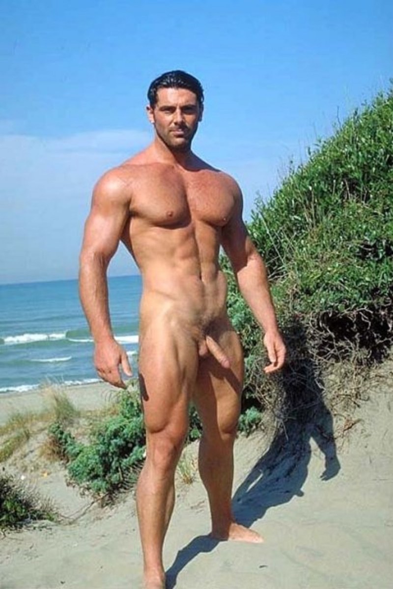 Muscular man on the beach naked