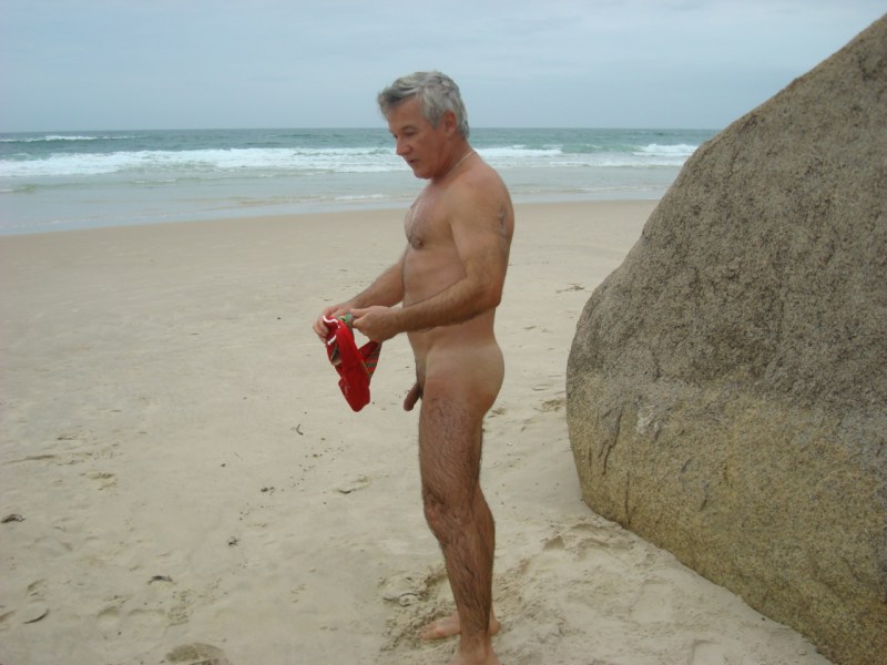 Mature man naked at sea