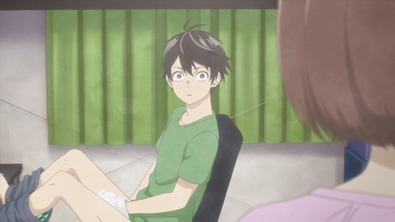 The guy sits with his legs apart