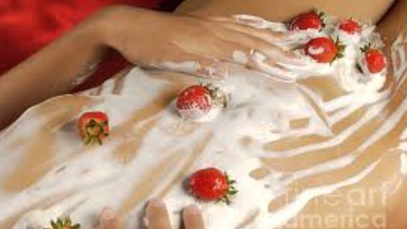 Strawberry with cream on the body