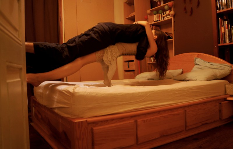 The girl lies on the bed