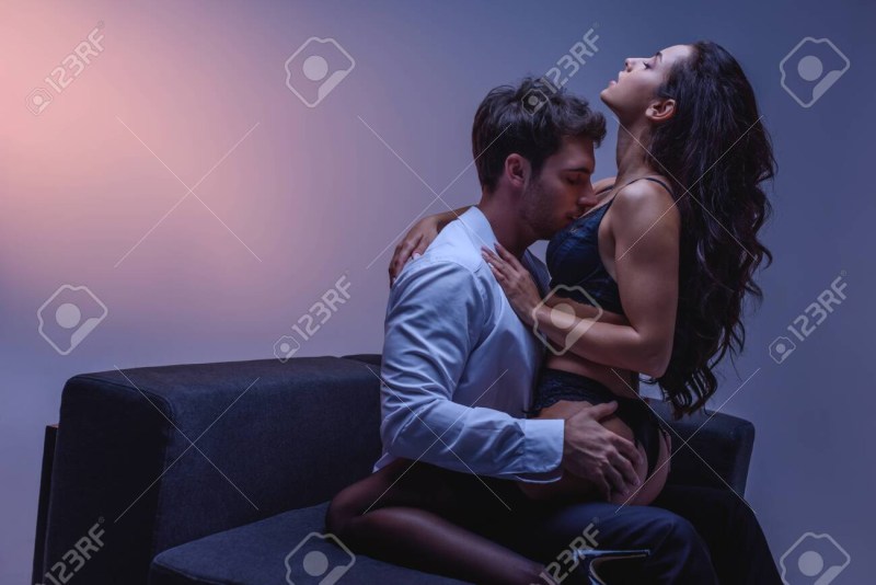 Guy and girl hug sitting