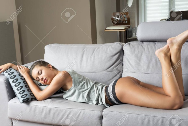 The girl leaned on the sofa