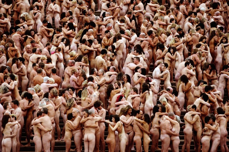 Naked women with a crowd of blacks