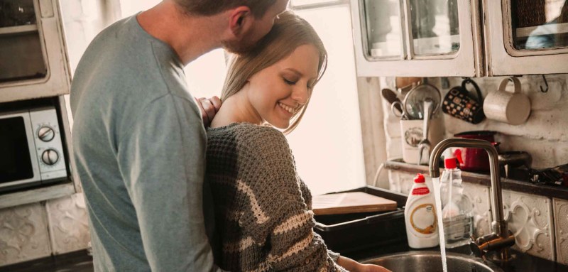 Passionately pressed against the wall
