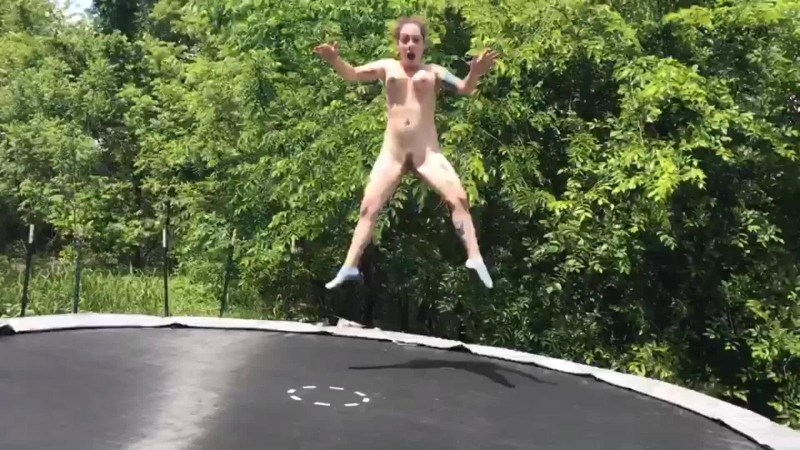 Naked women jump on a trampoline