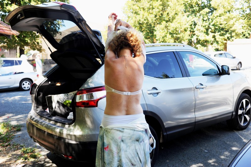 Woman Changing Clothes in Car