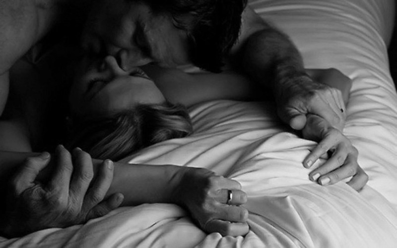 Man and woman naked in bed