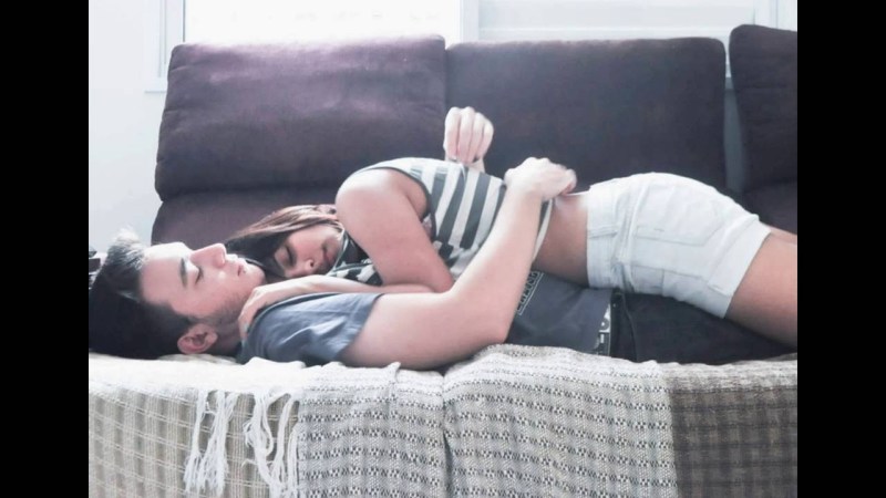 The girl lies on a guy in an embrace