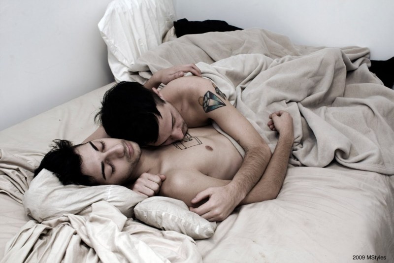 The guys sleep together in an embrace
