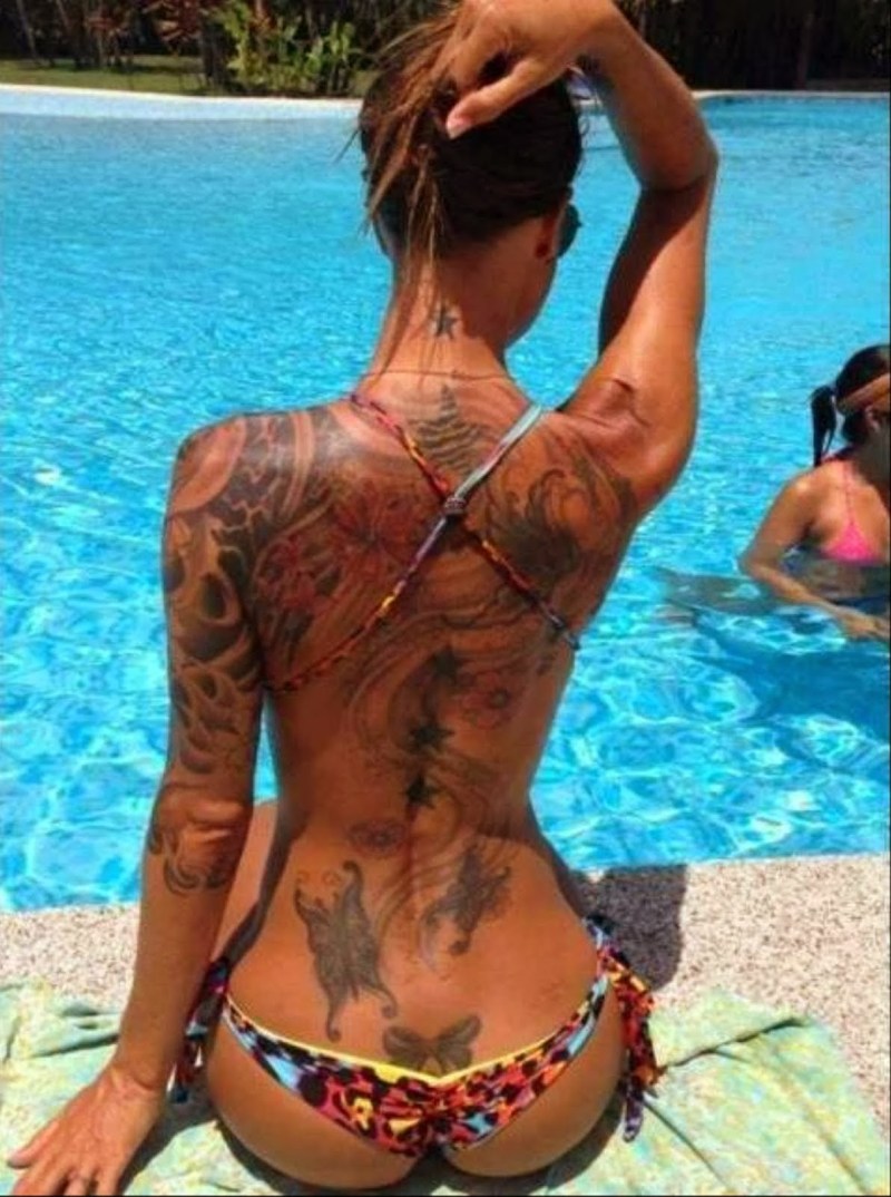 A lot of tattoos on a girl