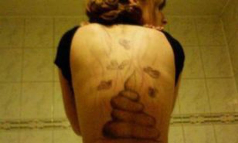 Tattoo Cross between the sternum in girls