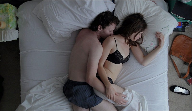 The girl takes off the sweater