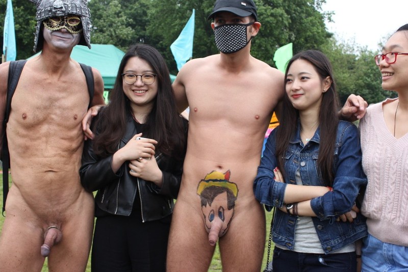 Dressed Japanese women and naked guy