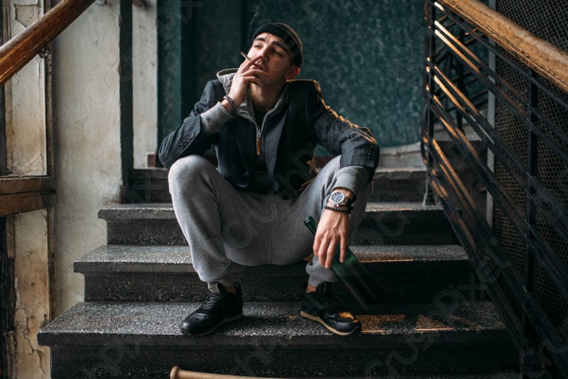 A man sits on the steps
