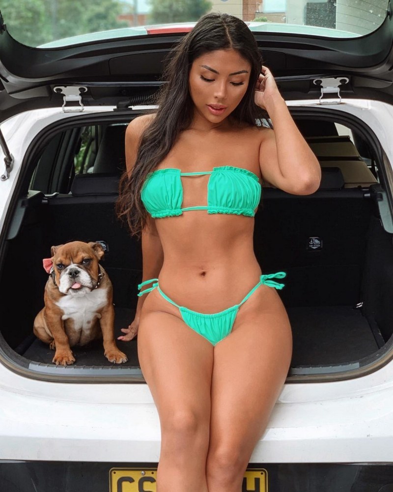 Girls with a figure of sand clock in jeans