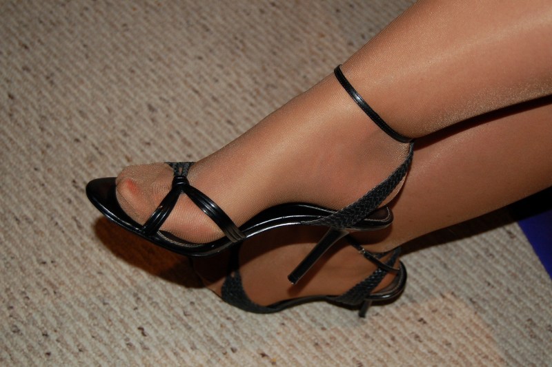Legs in sandals and stockings