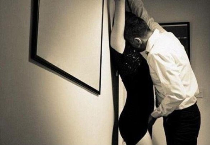 The guy pressed the girl against the wall