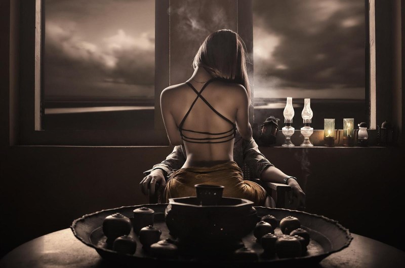 Woman on the table in front of a man