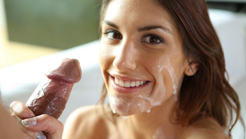 The girl smiles at a dick