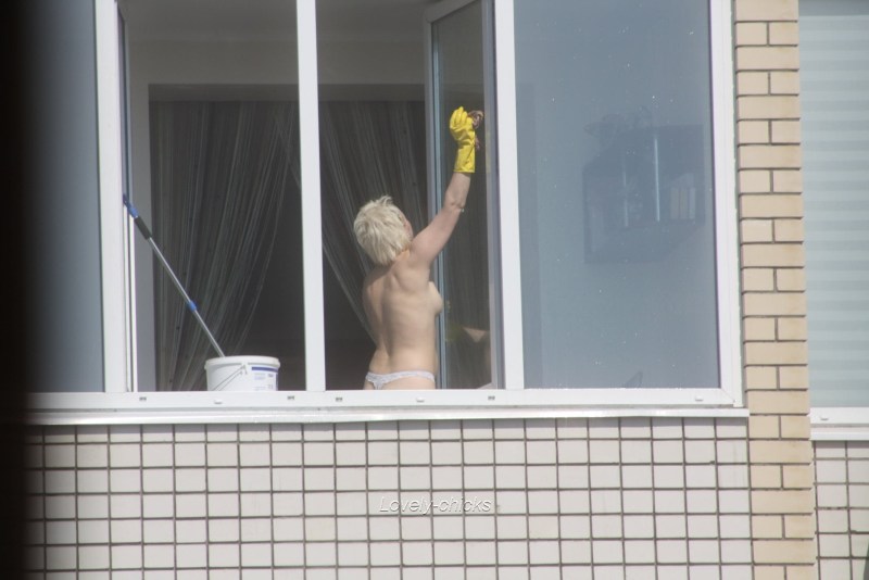 Peeping out the windows behind naked
