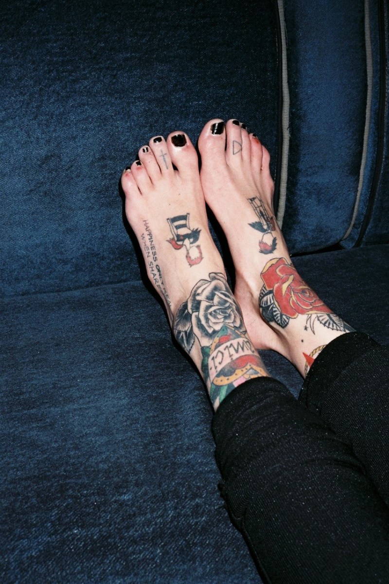 Beautiful girl in a tattoo with pigtails