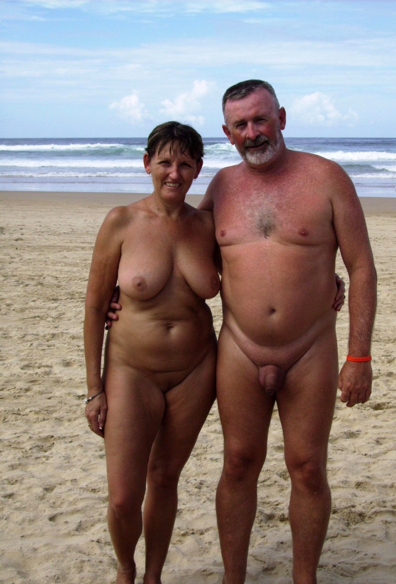 Naked elderly women and men on the beach