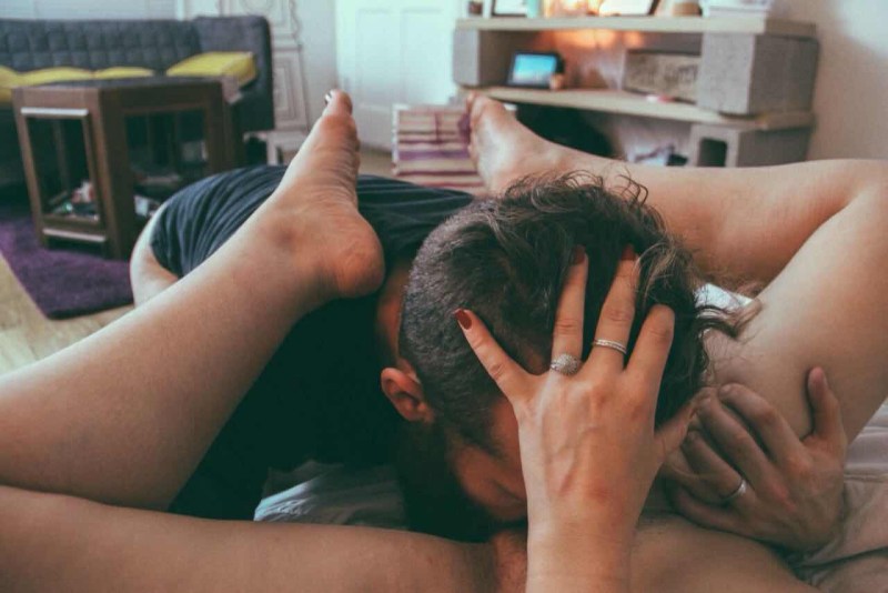 Beautiful girl sits on her face